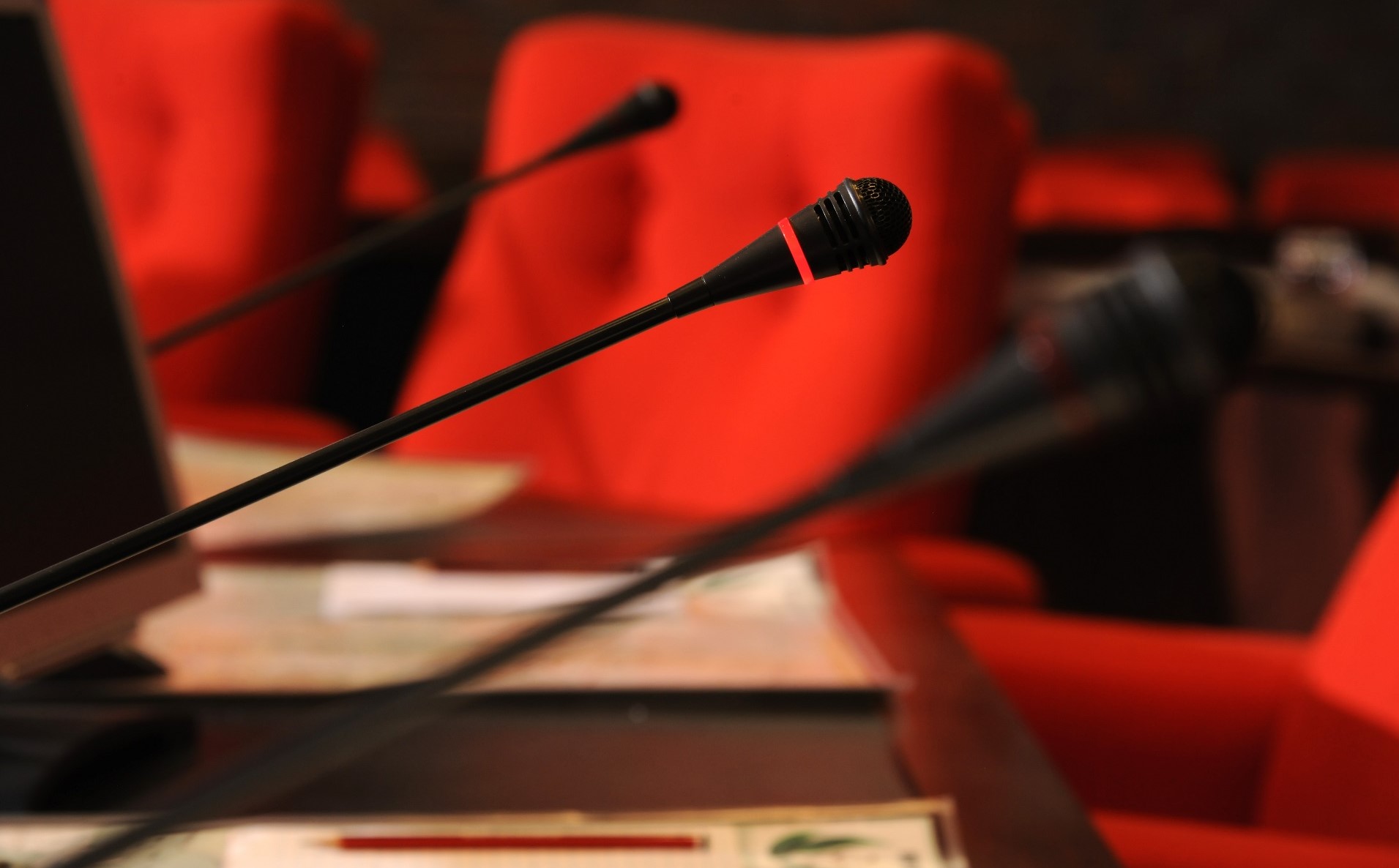 microphone, red chair, council chambers