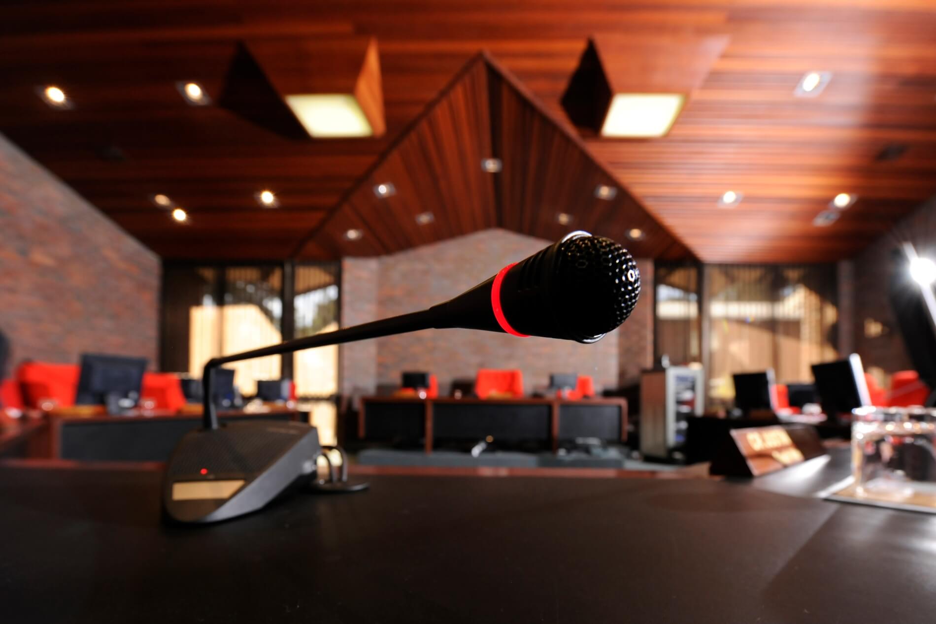 Close up view of a microphone in the council chambers 