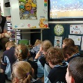 Studentsinsittinginaclassroominfrontofaneducator