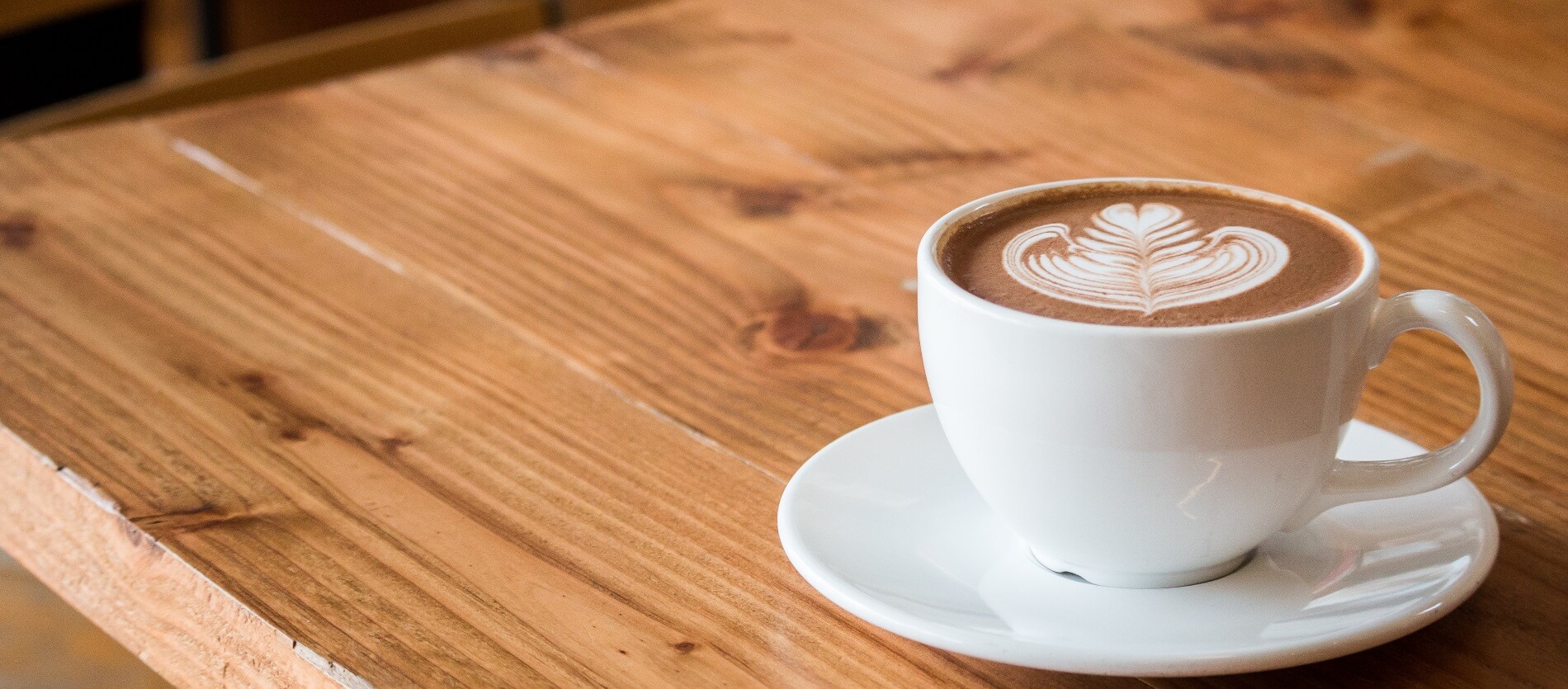 Cup of coffee on a wooden table