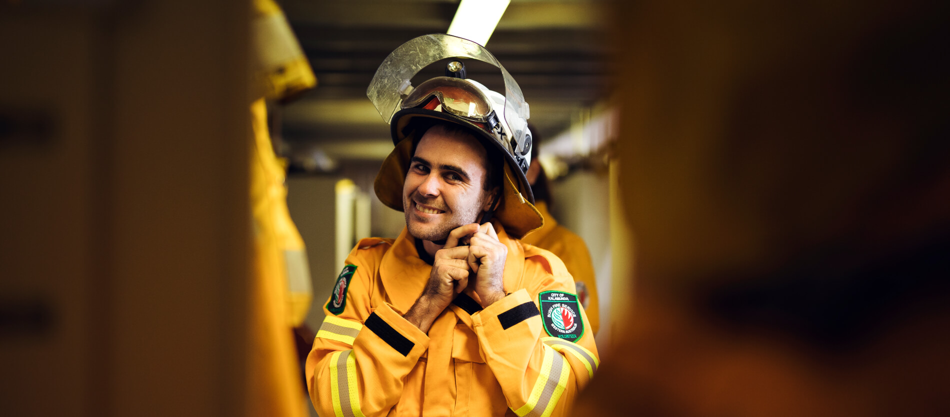 Local Fire crew member strapping their protective helmet