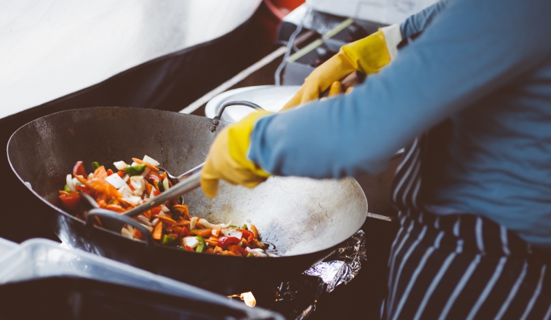 Image of chef stir frying food 