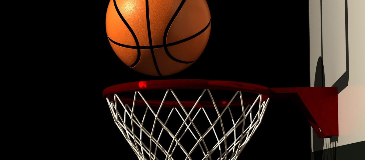 A basketball going into a hoop