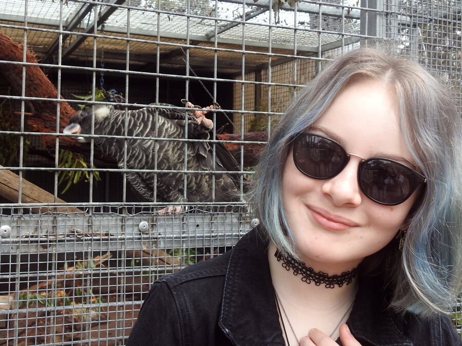 Tessa Forrest with a cockatoo - local hero August 2021