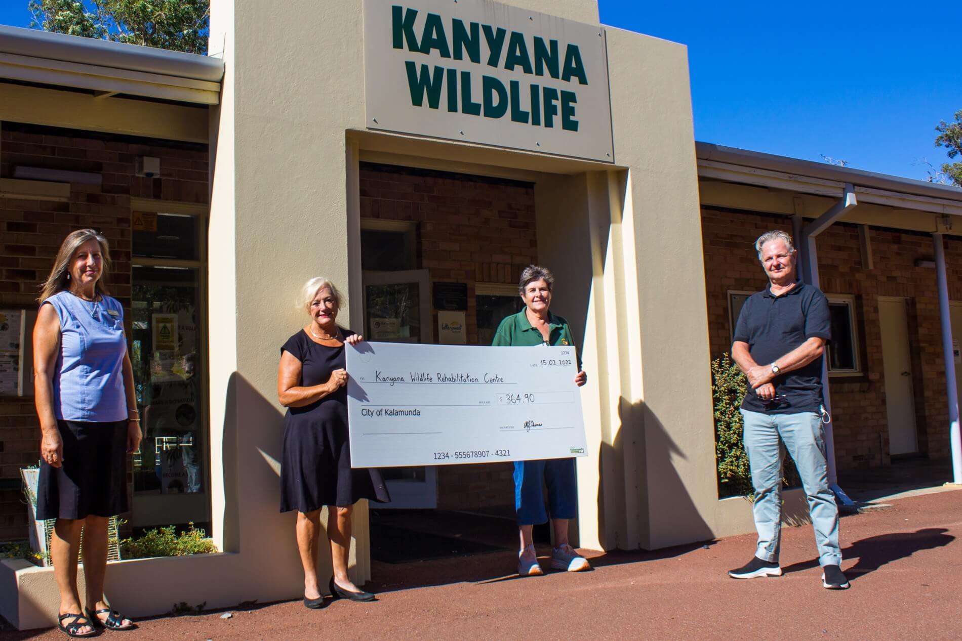 Kanyana being presented the cheque from the book sale donation in 2022