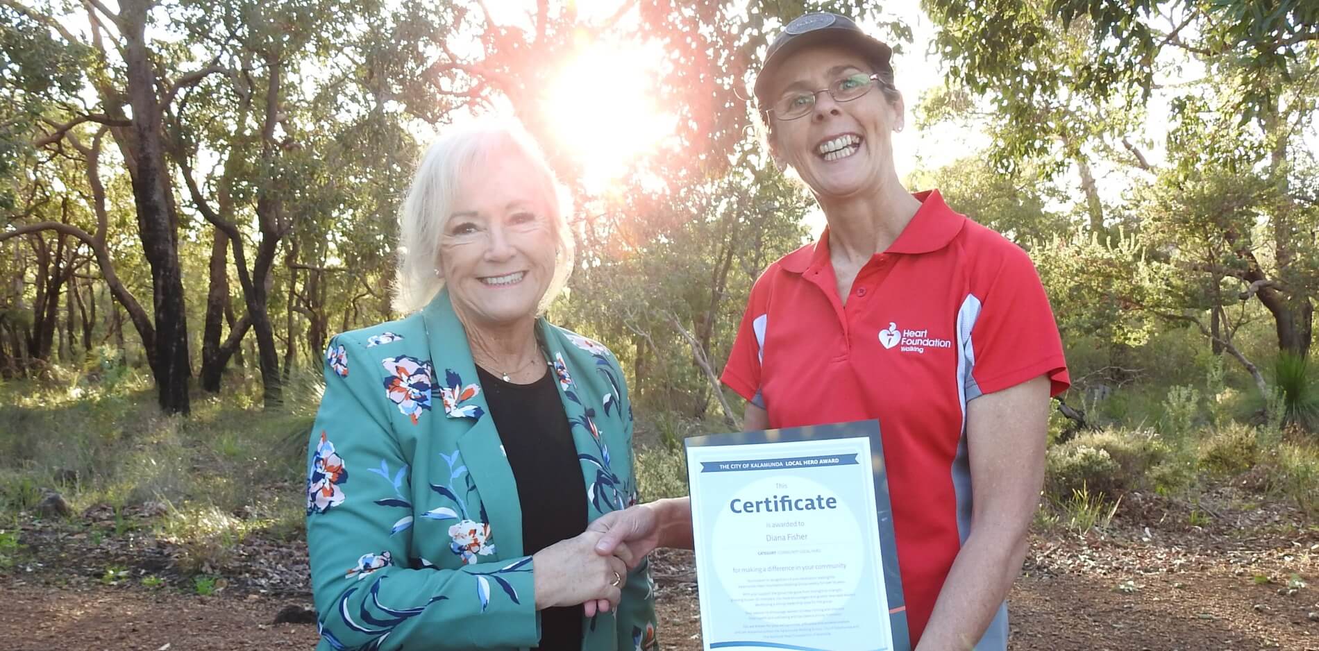 Diana Fisher with Mayor (left) receiving her Local Hero Certificate (June 2022)