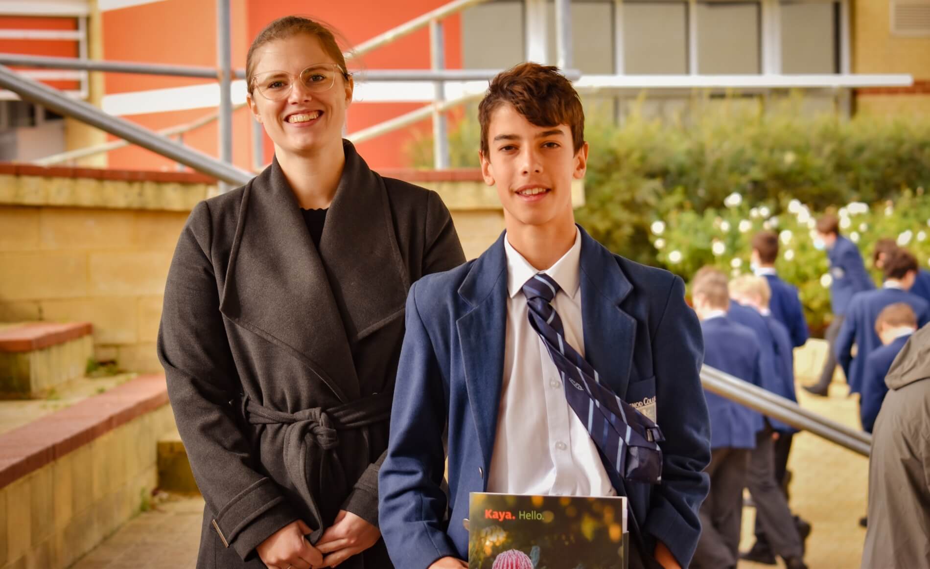 Mazenod College Year 9 classroom teacher, Ms Jessica Hewett  with  Cooper Rullo, Local Hero Aware winner