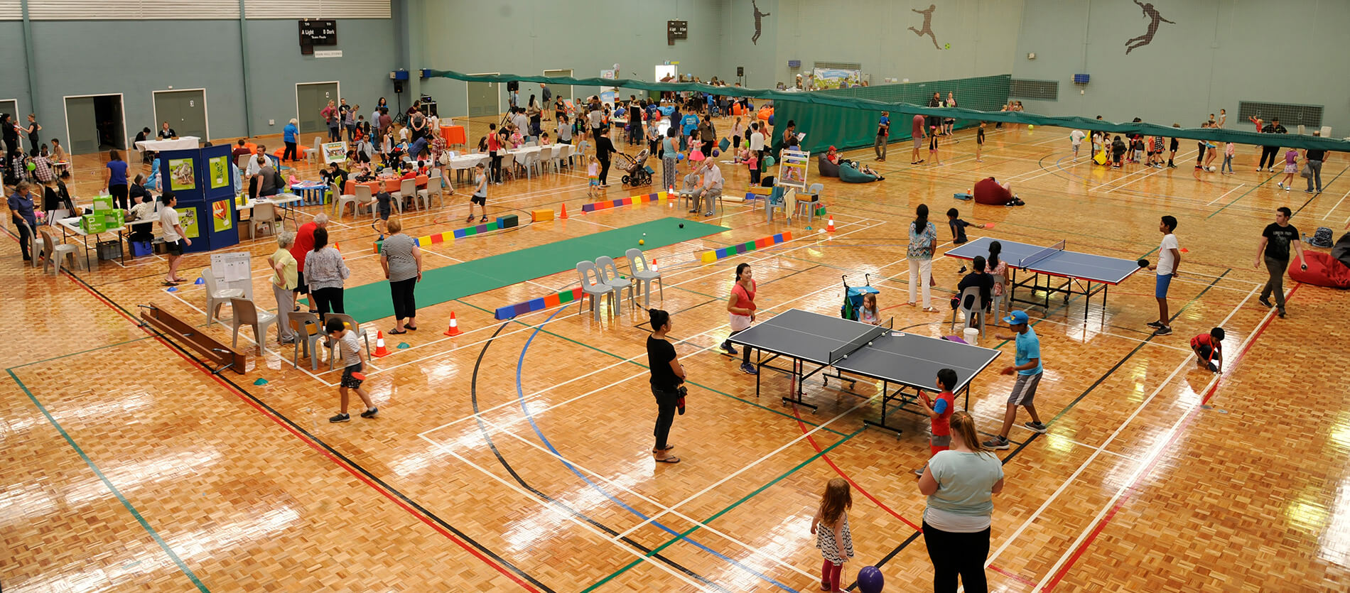 People participating in events at Hartfield Park Recreation Centre