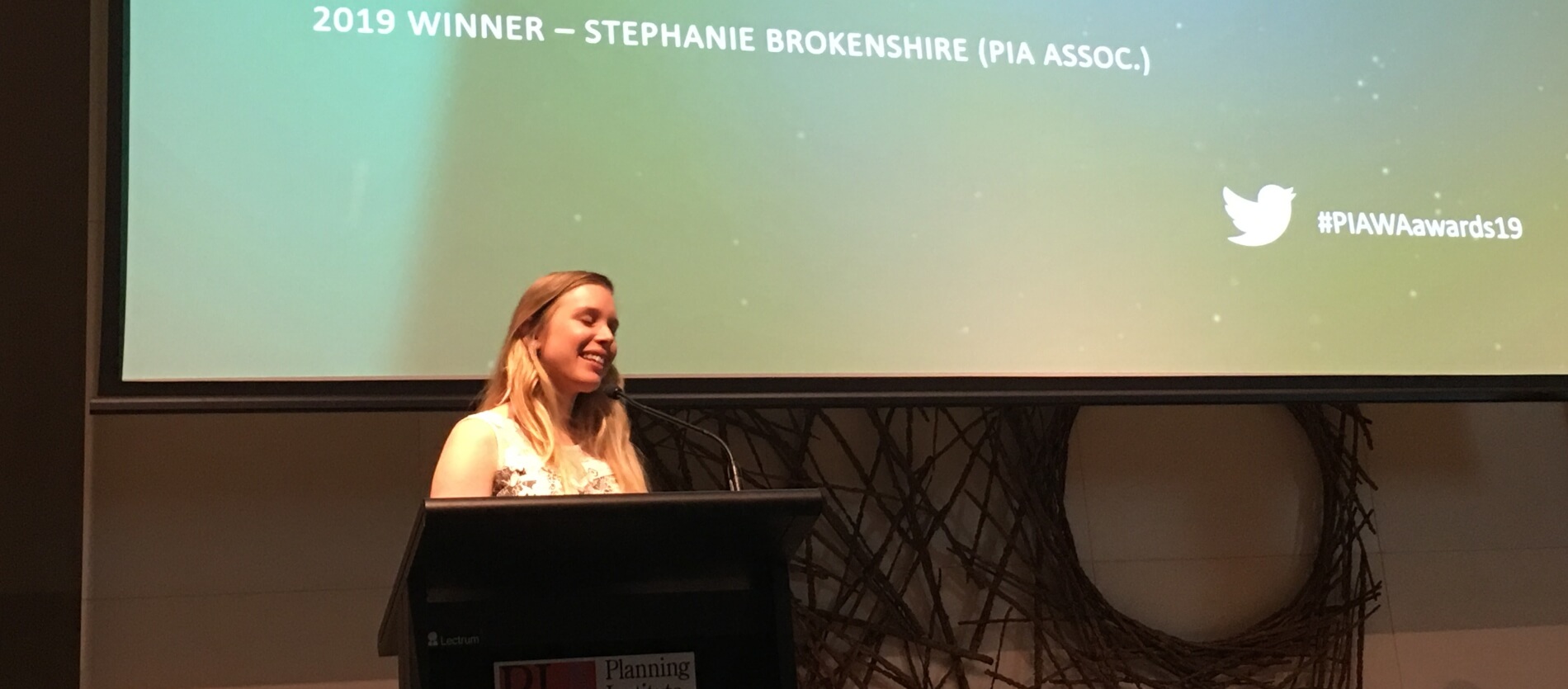 Stephanie Brokenshire, the 2019 Young Planner of the Year winner speaking at the podium