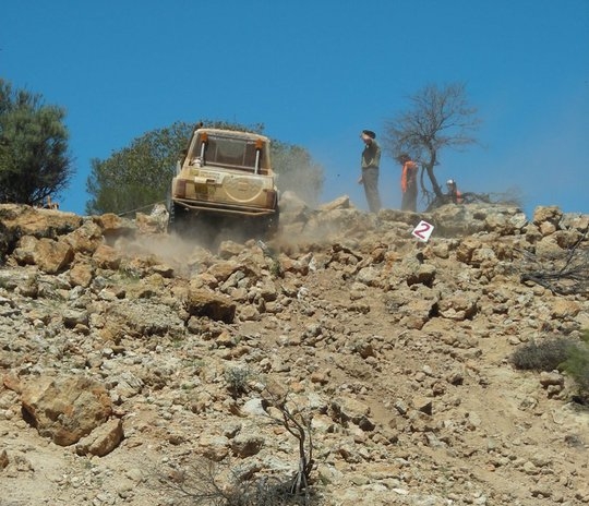 4 wheel drive going up a steep rocky gradient