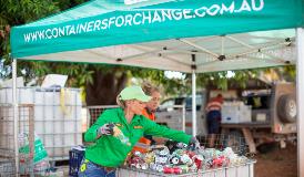 Person sorting Containers for Change deposits at local location 