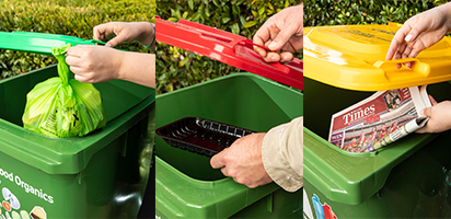 rubbish being thrown into the three bin lid system as examples